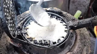 Waffles like you've never seen before! Coconut waffles grilled over charcoal - Laos street food