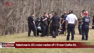 Naked man in JSO cruiser crashes off I-10 near Chaffee Rd.