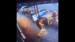 Guy throws up then slips on it, breaking his drink