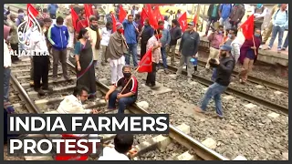 India farmers continue to block key roads to New Delhi