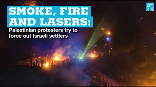 Smoke, fire and lasers: Palestinian protesters try to force out Israeli settlers