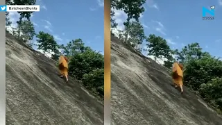 Monk furiously climbs rock hill without harness go viral