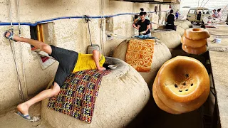 Bakers bake 12,000 legendary Samarkand breads every day in 90 degree heat.