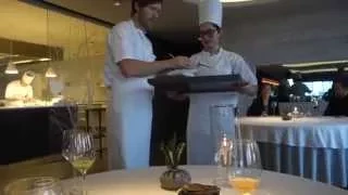 Chef Rasmus Kofoed plating a dish at Geranium in Copenhagen, Denmark