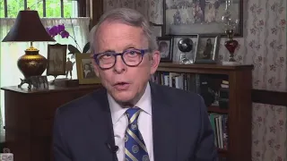 Ohio Governor Mike DeWine wears Cleveland Browns mask