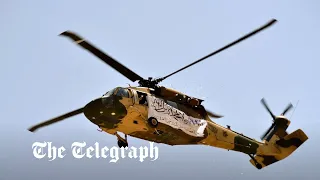 Taliban fly US Black Hawk helicopter above military parade in Kandahar