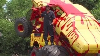 Tim Willis stops traffic in Cleveland's Fairfax neighborhood with monster truck collection, robot