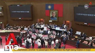 Protests erupt in Taiwan parliament over push for legislative reforms