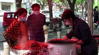 In Beijing, Peking duck sales unaffected despite COVID dining bans