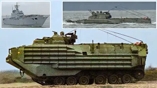 Amphibious fighting machines drive through water during beach assault, warship visits UK 🏖️