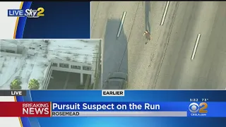 Pursuit Suspect Walks Onto 60 Freeway, Flags Down And Enters Black Sedan