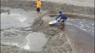 Kids build another giant dam and burst it