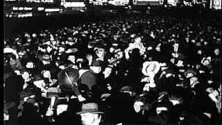 New year celebration in Times Square, January 1, 1937. Crowd is illuminated by la...HD Stock Footage