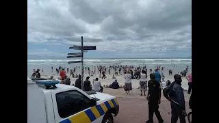 Muizenberg residents descend on the beach in protest of the lockdown restrictions of closed beaches