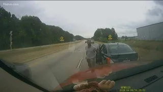 Dashcam video: Man dragged by car down road in a headlock