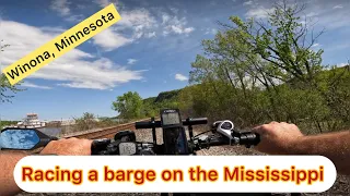 Racing a barge on the Mississippi in Winona, MN on May 8, 2024