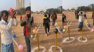 people gone crazy to burst the balloons by stick, balloon poping challenge, village game challenge.