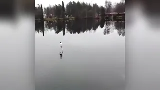 MAN RUNS ACROSS A LAKE