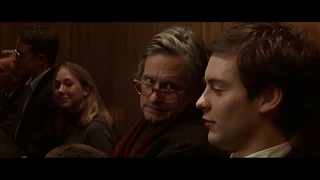 Tobey Maguire laughing loudly in an auditorium