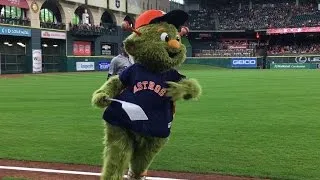 Astros mascot Orbit swats at Martinez, security guard