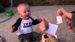 Baby Laughing at Ripping Paper (Falls Backwards)