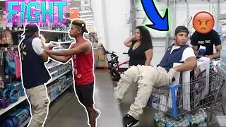 FAKE EMPLOYEE PRANK AT WALMART! (WORKERS FIGHT)