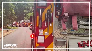 Firefighters battle house fire in Charlotte, two people rescued