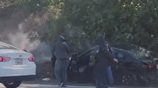 Masked men pull off crash robbery on California freeway