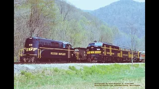 RARE locomotives run side by side on WESTERN MARYLAND , an unhappy photo-line at run-by.  4/24/2004