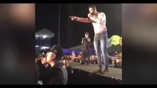 Gusttavo Lima é atingido por bebida e dá lição de moral com convite para fã; assista