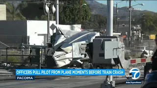 Pilot pulled from crashed plane in Pacoima moments before train slammed into aircraft | ABC7