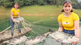 The girl spreads a net overnight to catch big fish, living alone on the lake.