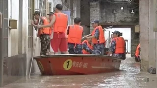 Firefighters Evacuate 40 Residents Trapped by Flood in S China County