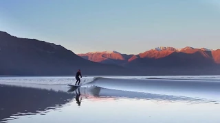 Surfer Rides Alaska's Turnagain Arm Bore Tide