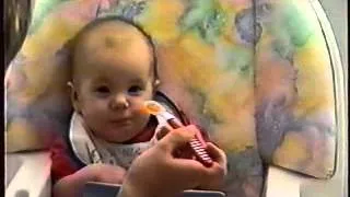 Baby eating carrots for first time