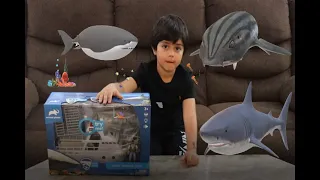 Brad is unboxing  shark research boat toy!