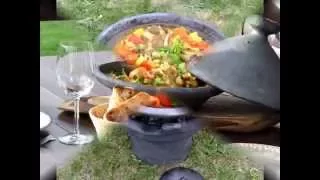 Cooking outside - tagine on fire in Lithuanian nature at woods of the National Park -"DZŪKIJOS UOGA"