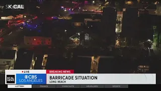 Potentially armed suspect barricaded inside home in Long Beach