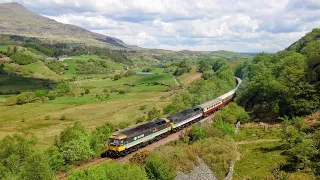 47712 and 47828 pass Roman Bridge on their way from Chesterfield to Blaenau Ffestiniog, 15 May 2024.