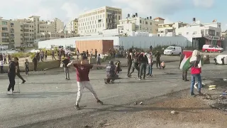 Palestinians throw stones at Israeli forces in West Bank | AFP