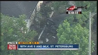 AERIAL: Car bursts into flames when it crashes into St. Petersburg home