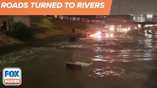 Cars Completely Submerged Along Flooded Dallas, Texas Interstate