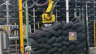 Robot-assisted tire depalletizing