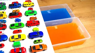 Various Diecast Model Cars Sliding Into The Yellow And Blue Water