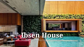 Elegant House Design uses Sliding Panels & Huge Vertical Garden for Privacy