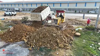 EpFirst_KOMATSU D31P Dozer Push Soils Clutter​ Making On Road And Dump Trucks Unloading.