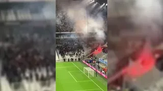 Rival fans throw flares at each other in, Marseille vs Galatasaray