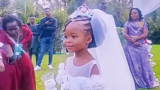 BABY SHINE KASOLO'S DAUGHTER HANDING OVER THE WEDDING RINGS.