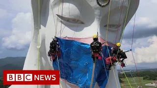 Giant Buddhist statue gets Covid face mask in Japan - BBC News