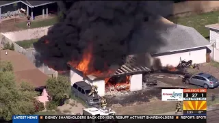 Firefighters battle house fire in north Phoenix